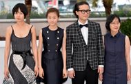 South Korean actress Doona Bae (L) Actor Song Sae Byuk (C) and South Korean actress Kim Sae Ron pose during the photocall of 'Dohee-Ya' (A Girl At My Door) at the 67th Cannes Film Festival in Cannes, France on May 20, 2014.- Source: Getty